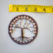 Measurement using ruler shows this brown wire wrapped trees compact size. Perfect for small spaces